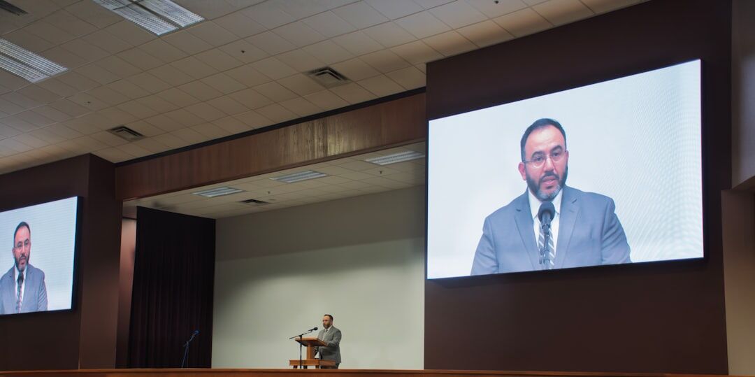politician speaking at podium