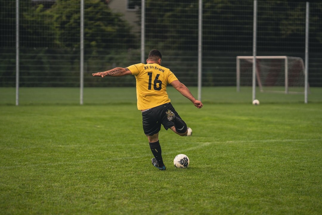 soccer player scoring goal
